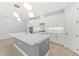 Modern kitchen with white cabinets, a large island, and updated features at 6232 Sea Air Dr, Apollo Beach, FL 33572