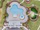 Aerial view showing resort-style pool, lounge chairs, and playground at 6232 Sea Air Dr, Apollo Beach, FL 33572