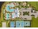Aerial view of community pool, tennis courts, and parking at 6232 Sea Air Dr, Apollo Beach, FL 33572