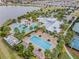 Aerial view of community pool, clubhouse, and surrounding landscape at 6232 Sea Air Dr, Apollo Beach, FL 33572