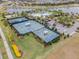 Aerial view of tennis and pickleball courts near a clubhouse at 6232 Sea Air Dr, Apollo Beach, FL 33572