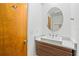 Elegant bathroom with a modern vanity, designer sink, and wood accents, creating a spa-like retreat at 6543 Barcelona Blvd, Brooksville, FL 34602