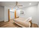 Cozy bedroom with wood floors, fan, and a closet, designed for comfort and convenience at 6543 Barcelona Blvd, Brooksville, FL 34602