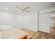 Bright bedroom with a ceiling fan, wood floors, and a comfortable bed, creating a relaxing atmosphere at 6543 Barcelona Blvd, Brooksville, FL 34602