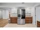 Well-equipped kitchen featuring stainless steel refrigerator, ample cabinet space, and granite countertops at 6543 Barcelona Blvd, Brooksville, FL 34602
