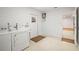 Laundry room with washer, dryer, utility sink, and access to the backyard at 6543 Barcelona Blvd, Brooksville, FL 34602