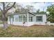 Newly renovated home with a sunroom and a landscaped front yard at 6699 78Th N Ave, Pinellas Park, FL 33781