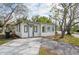 Charming bungalow with a newly paved driveway and well-maintained landscaping at 6699 78Th N Ave, Pinellas Park, FL 33781