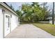 White house exterior with a small front patio and landscaped yard at 6699 78Th N Ave, Pinellas Park, FL 33781