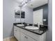 Double vanity bathroom with granite countertop and white cabinets at 6944 Towne Lake Rd, Riverview, FL 33578