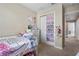 bedroom with twin bed, closet, and window at 6944 Towne Lake Rd, Riverview, FL 33578