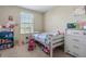 bedroom with twin bed, dresser, and window at 6944 Towne Lake Rd, Riverview, FL 33578