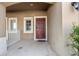 Front entry with red door and small porch at 6944 Towne Lake Rd, Riverview, FL 33578