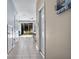 View down a hallway showing access to the kitchen and backyard at 6944 Towne Lake Rd, Riverview, FL 33578