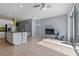 Open concept kitchen and living area with access to patio at 6944 Towne Lake Rd, Riverview, FL 33578