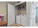 Convenient laundry closet with washer and dryer at 6944 Towne Lake Rd, Riverview, FL 33578