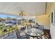 Covered back porch with ceiling fan and outdoor seating at 718 40Th Ne Ave, St Petersburg, FL 33703