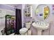 Bathroom with a pedestal sink, toilet, and shower/tub combo at 718 40Th Ne Ave, St Petersburg, FL 33703