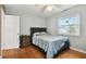 Comfortable bedroom with hardwood floors and ample closet space at 718 40Th Ne Ave, St Petersburg, FL 33703