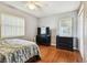 Spacious bedroom with hardwood floors and built-in shelving at 718 40Th Ne Ave, St Petersburg, FL 33703