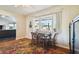 Charming dining area with bay window and wood table set at 718 40Th Ne Ave, St Petersburg, FL 33703