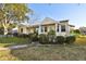 House exterior view showcasing the front yard and walkway at 718 40Th Ne Ave, St Petersburg, FL 33703