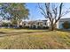 House exterior view showcasing the front yard and walkway at 718 40Th Ne Ave, St Petersburg, FL 33703