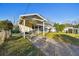 Inviting house front with covered carport and landscaping at 718 40Th Ne Ave, St Petersburg, FL 33703