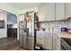 Modern kitchen with stainless steel refrigerator and gray cabinets at 718 40Th Ne Ave, St Petersburg, FL 33703