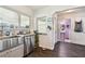 Kitchen with stainless steel sink, dishwasher and view into bathroom at 718 40Th Ne Ave, St Petersburg, FL 33703