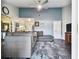 Spacious living room with gray sectional sofa and ceiling fan at 718 40Th Ne Ave, St Petersburg, FL 33703