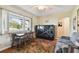 Cozy living room featuring a sofa, dining table, and large window at 718 40Th Ne Ave, St Petersburg, FL 33703