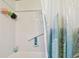 Clean shower with grab bar and updated tile at 718 40Th Ne Ave, St Petersburg, FL 33703