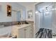 Clean bathroom, featuring a single vanity and updated fixtures at 7643 Vienna Ln, Port Richey, FL 34668