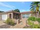 Front entrance with a covered patio and brick walkway at 7643 Vienna Ln, Port Richey, FL 34668