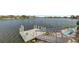 Private dock with steps leading to a serene lake at 7643 Vienna Ln, Port Richey, FL 34668