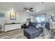 Relaxing living room features a sectional sofa and media console at 7643 Vienna Ln, Port Richey, FL 34668