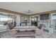 Outdoor patio with dining table and access to pool area at 7643 Vienna Ln, Port Richey, FL 34668