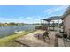 Spacious patio with pool and lake view at 7643 Vienna Ln, Port Richey, FL 34668
