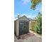 Large storage shed in backyard with double doors at 7643 Vienna Ln, Port Richey, FL 34668