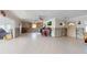 Kitchen and living area with partially completed renovations and tiled floors at 7824 3Rd S Ave, St Petersburg, FL 33707