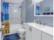 Clean bathroom, featuring a shower/tub combo and white vanity at 8174 Terrace Garden N Dr # 110, St Petersburg, FL 33709
