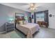 Bedroom with a queen-size bed and a view of the backyard at 8174 Terrace Garden N Dr # 110, St Petersburg, FL 33709