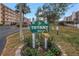 Tiffany 8174 condo entrance sign with landscaping and flamingo decor at 8174 Terrace Garden N Dr # 110, St Petersburg, FL 33709