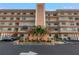 Exterior view of Tiffany 8174 condo building, showing landscaping and parking at 8174 Terrace Garden N Dr # 110, St Petersburg, FL 33709