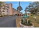 Exterior view of Tiffany 8174 condo building, showing landscaping and parking at 8174 Terrace Garden N Dr # 110, St Petersburg, FL 33709