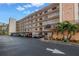 Exterior view of Tiffany 8174 condo building, showing landscaping and parking at 8174 Terrace Garden N Dr # 110, St Petersburg, FL 33709