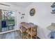 Small dining area with table and chairs, near sliding doors to patio at 8174 Terrace Garden N Dr # 110, St Petersburg, FL 33709