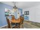 Dining room with round table and wood floors at 8174 Terrace Garden N Dr # 110, St Petersburg, FL 33709