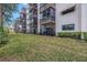 Exterior view of condo building and landscaping at 8174 Terrace Garden N Dr # 110, St Petersburg, FL 33709